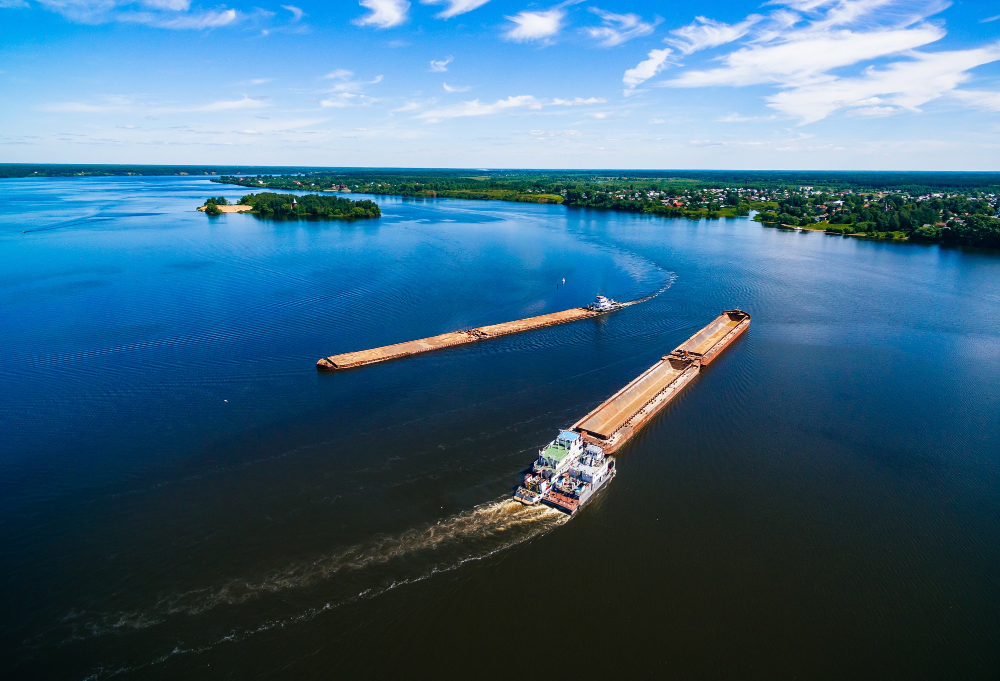 Aerial view of Barge or offshore vessel with cargo on the river.